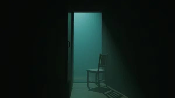 Dark minimalist room with turquoise walls, open door, and single wooden chair visible through doorway